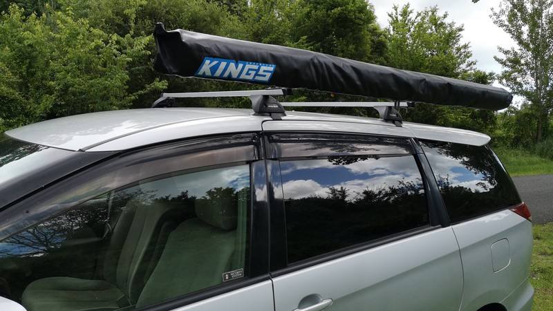 Roof rack on the HMC107 Toyota Estima campervan with a rolled awning mounted along the side