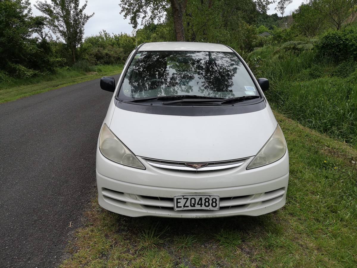 Front of the white Toyota Estima campervan with registration EZQ488