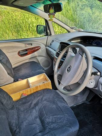 Driver's seat, steering wheel and plywood console box of the FPS382 Toyota Estima campervan