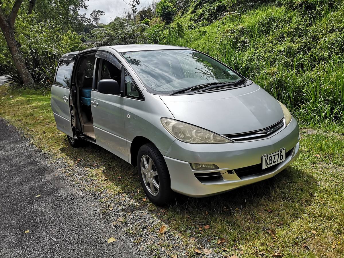 Silver 2005 Toyota Estima self-contained campervan for sale, registration KBZ76, side door open