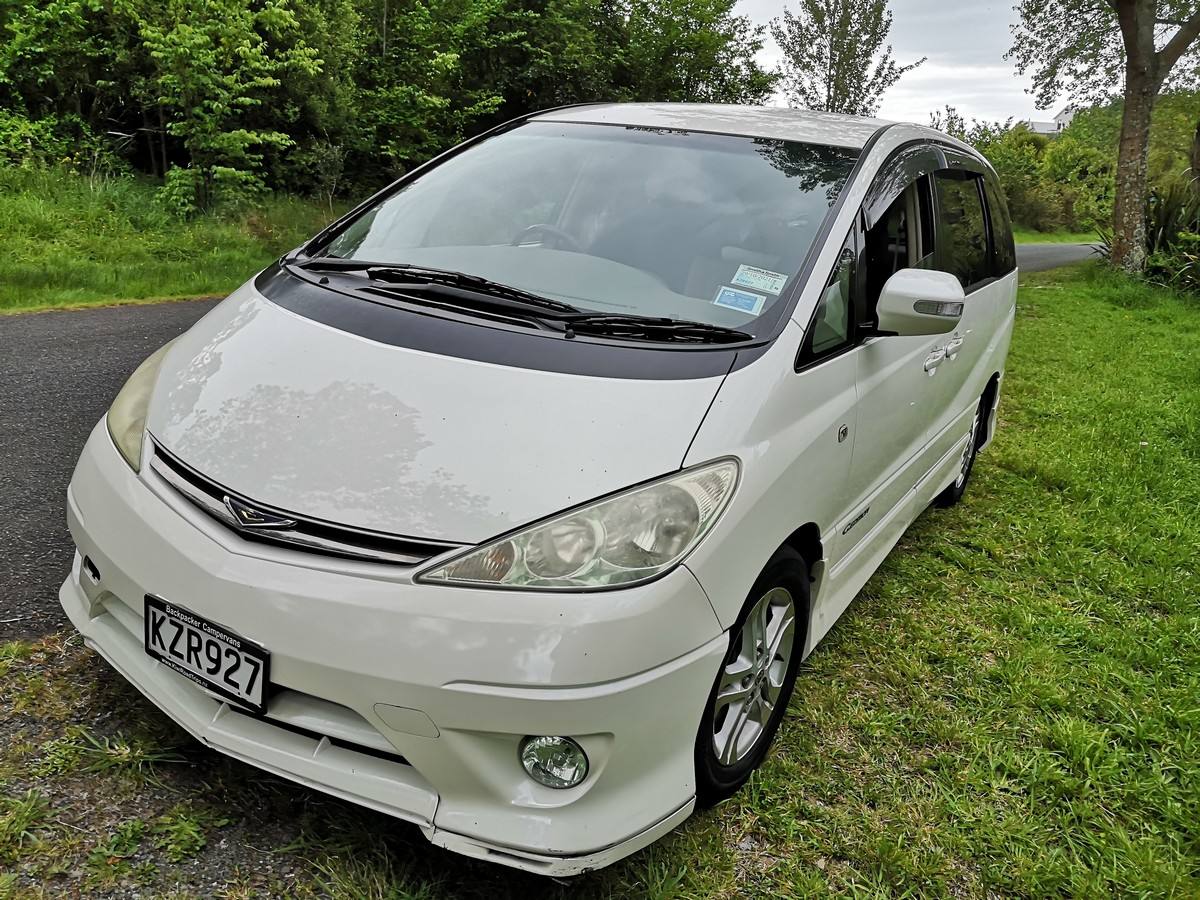 White 2004 Toyota Estima self-contained campervan for sale, registration KZR927, front three-quarter view