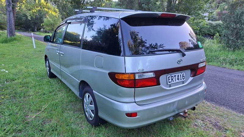 Rear three-quarter view of the silver 2002 Toyota Estima campervan ERT416