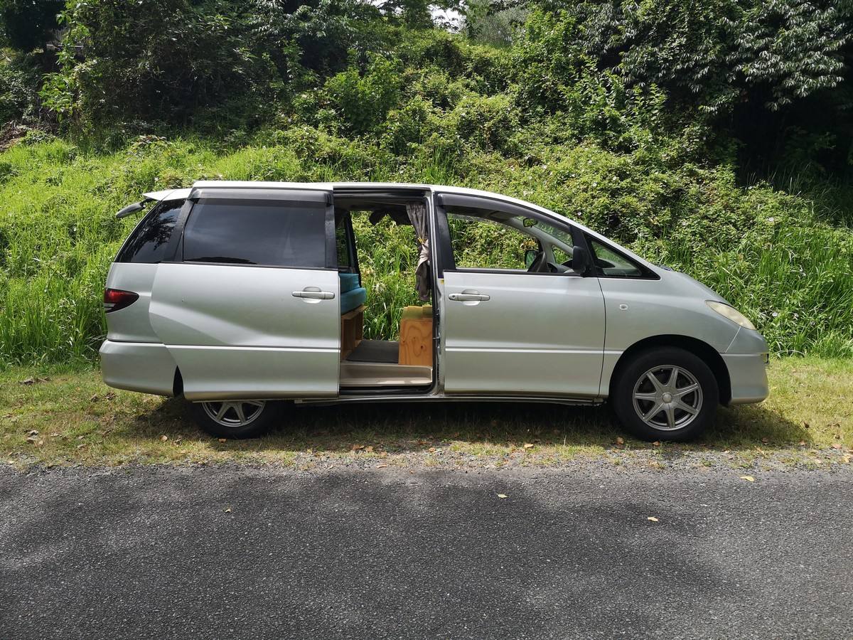 Side view of the silver 2005 Toyota Estima campervan KBZ76 with the side door open