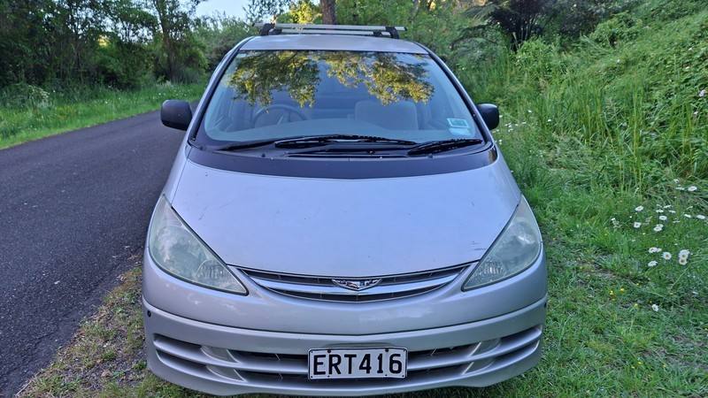 Front of the silver Toyota Estima campervan with registration ERT416, roof rack fitted