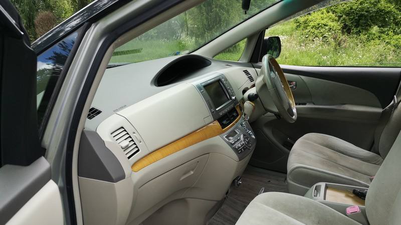 Inside the HMC107 Toyota Estima looking across the dashboard from the passenger side
