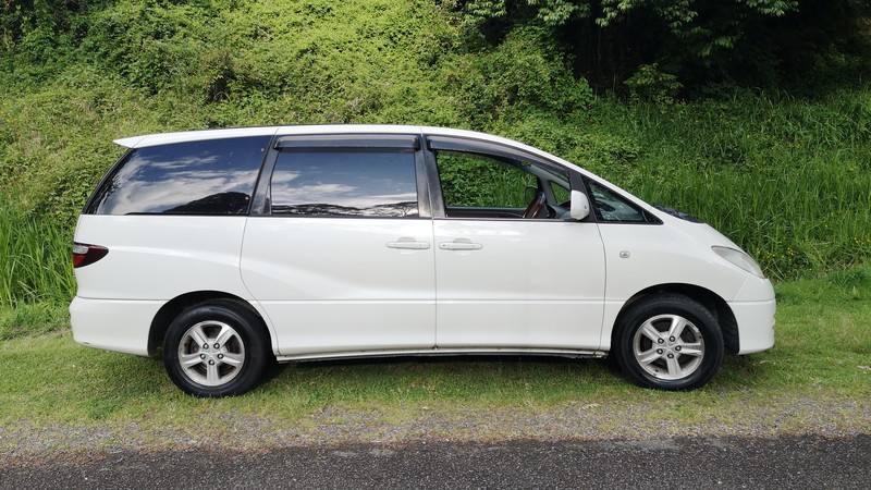 White 2000 Toyota Estima self-contained campervan for sale in New Zealand, driver's side view