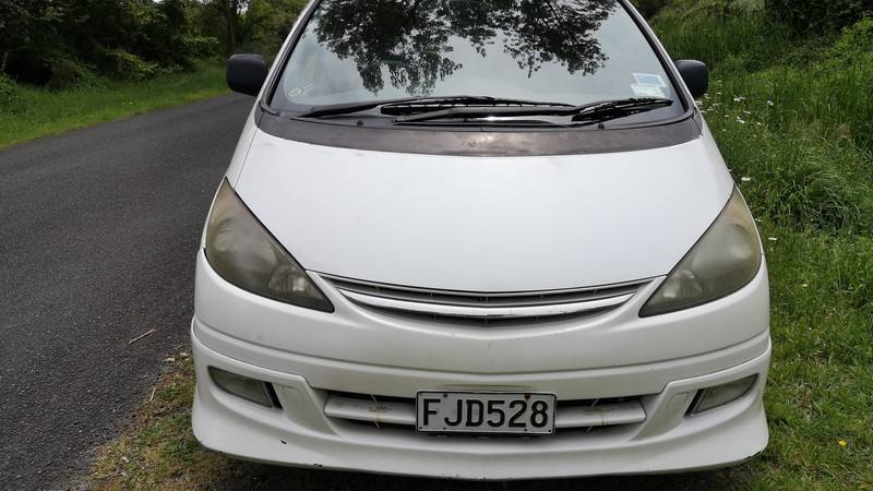 Front of the white Toyota Estima campervan with registration FJD528