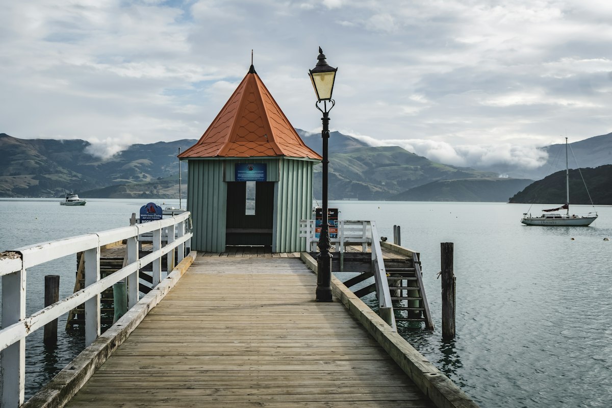 Wharf and lighthouse-style hut at Akaroa Harbour