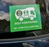 Green self-contained sticker on the windscreen of the FDK492 Toyota Estima campervan