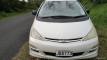 Front of the white Toyota Estima campervan with registration JBB773, parked on a country road