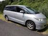 Front three-quarter view of the silver 2007 Toyota Estima campervan JTQ214 on a country road