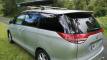 Rear three-quarter view of the HMC107 campervan, roof rack and awning along the roofline