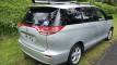 Rear three-quarter view of the silver Toyota Estima campervan with registration HMC107