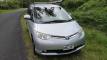 Silver 2007 Toyota Estima self-contained campervan for sale, registration HMC107, parked on a country road