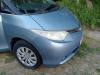 Front corner of the blue DJR846 Toyota Estima campervan, headlight and alloy wheel