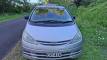 Front of the silver Toyota Estima campervan with registration ERT416, roof rack fitted