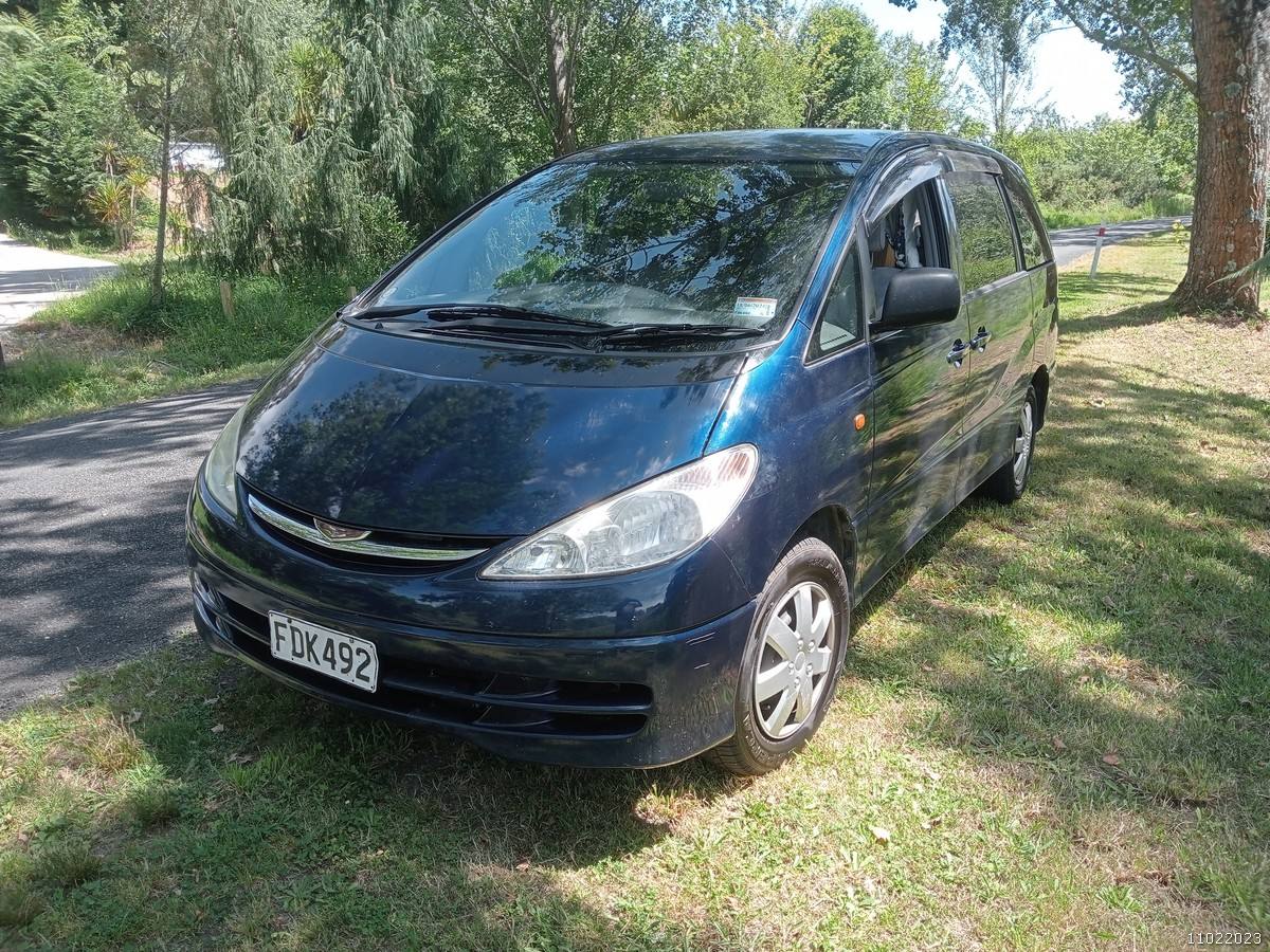 Dark blue 2000 Toyota Estima self-contained campervan for sale, registration FDK492, front three-quarter view