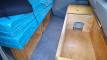 Plywood storage boxes built under the bed platform of the EYC409 campervan