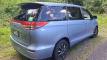 Rear three-quarter view of the blue EYC409 Toyota Estima campervan with the self-contained sticker