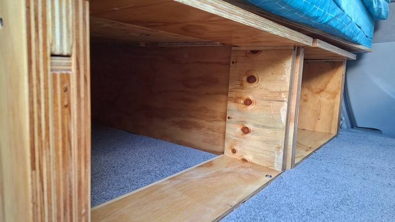 Storage space under the bed platform of the EYC409 Toyota Estima campervan