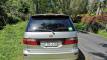 Back of the silver Toyota Estima campervan FBE338, with the green self-contained sticker in the rear window