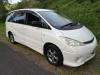 White 2005 Toyota Estima self-contained campervan for sale, front three-quarter view from the driver's side