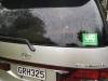 Green self-contained sticker in the rear window of the GRH325 Toyota Estima campervan
