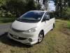 Front three-quarter view of the FQK81 Toyota Estima campervan on a country road