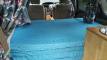 The JBB773 campervan's double bed made up, looking forward to the front seats