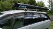 Roof rack on the HMC107 Toyota Estima campervan with a rolled awning mounted along the side