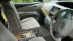 Front seats, steering wheel and centre console of the HMC107 Toyota Estima campervan
