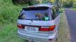 Back of the silver Toyota Estima campervan with registration ERT416 and the self-contained sticker