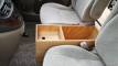 Plywood console box fitted between the front seats of the JBB773 Toyota Estima campervan