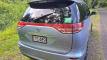Back of the blue EYC409 Toyota Estima campervan, registration plate and self-contained sticker