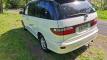 Rear three-quarter view of the white Toyota Estima campervan with registration FAC789