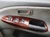 Driver's door armrest and window switches in the FPS382 Toyota Estima campervan