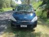 Front of the dark blue Toyota Estima campervan with registration FDK492