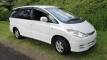 White 2000 Toyota Estima self-contained campervan for sale, front three-quarter view from the driver's side