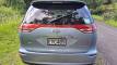 Back of the blue Toyota Estima campervan with registration EYC409 and the self-contained sticker