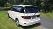 Rear three-quarter view of the GQG541 Toyota Estima campervan with the self-contained sticker in the window