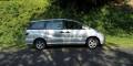 Side view of the silver Toyota Estima campervan GBB26 on a quiet country road