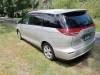 Rear three-quarter view of the gold 2006 Toyota Estima campervan KHP570