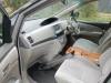 Passenger side of the JNQ545 Toyota Estima cab, dashboard and console box