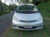 Front of the silver Toyota Estima campervan with registration GRH325, parked on a country road