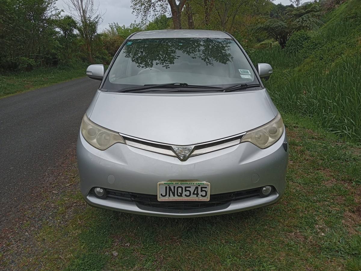 Front of the silver Toyota Estima campervan with registration JNQ545