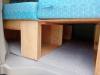 Close view of the plywood storage boxes under the bed platform of the KHP570 campervan
