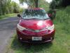 Front of the red Toyota Estima campervan with registration JAK653