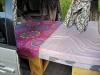 Bed made up in the FPS382 campervan, seen through the open side door