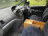 Driver's seat and dashboard of the HDP33 Toyota Estima, with the plywood console box between the front seats