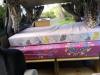 The FPS382 campervan's bed made up, looking forward towards the cab